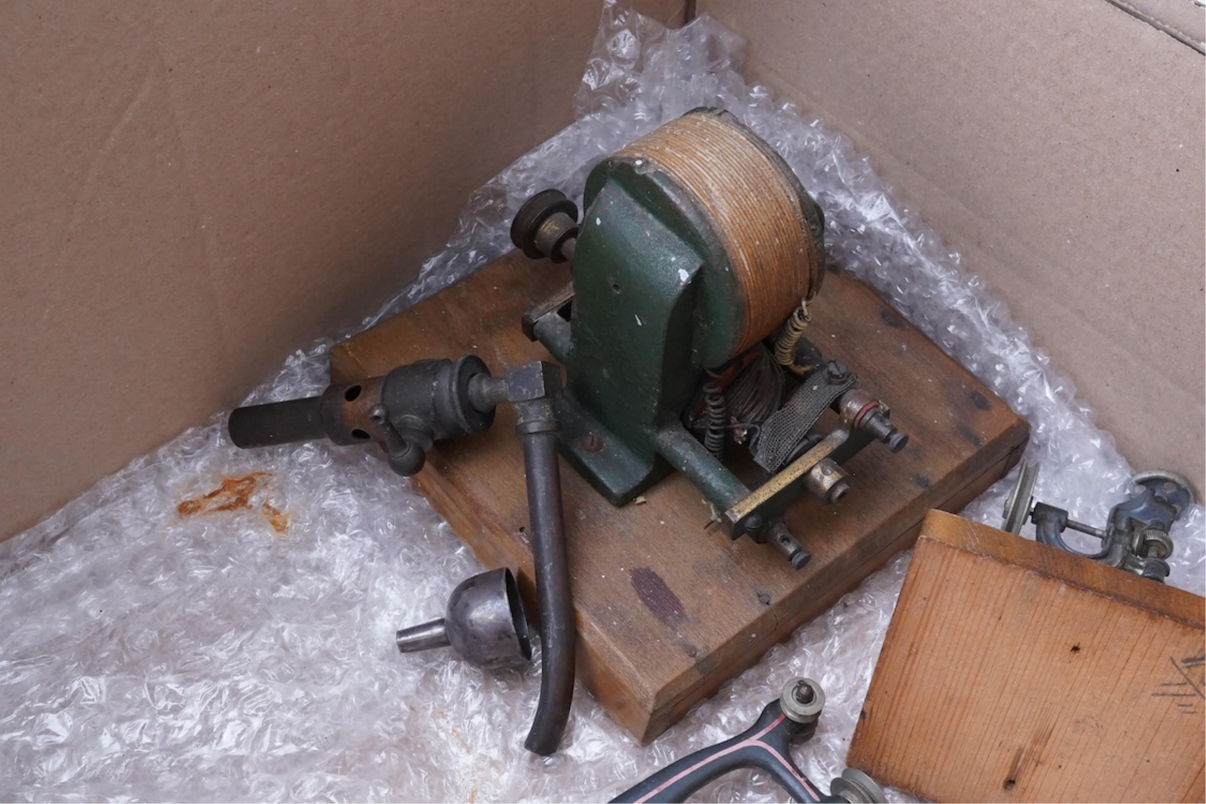 An early 20th century Bing live steam single cylinder vertical stationary engine, of brass, tinplate and cast iron construction, 38cm high, 10.5cm diameter flywheel, complete with the burner, together with a steam plant